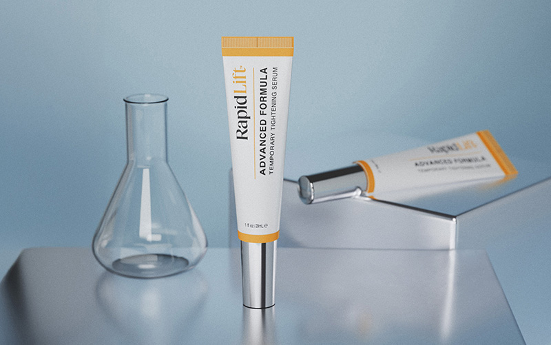 RapidLift advanced formula eye treatment serum tube on a blue surface with glass elements.